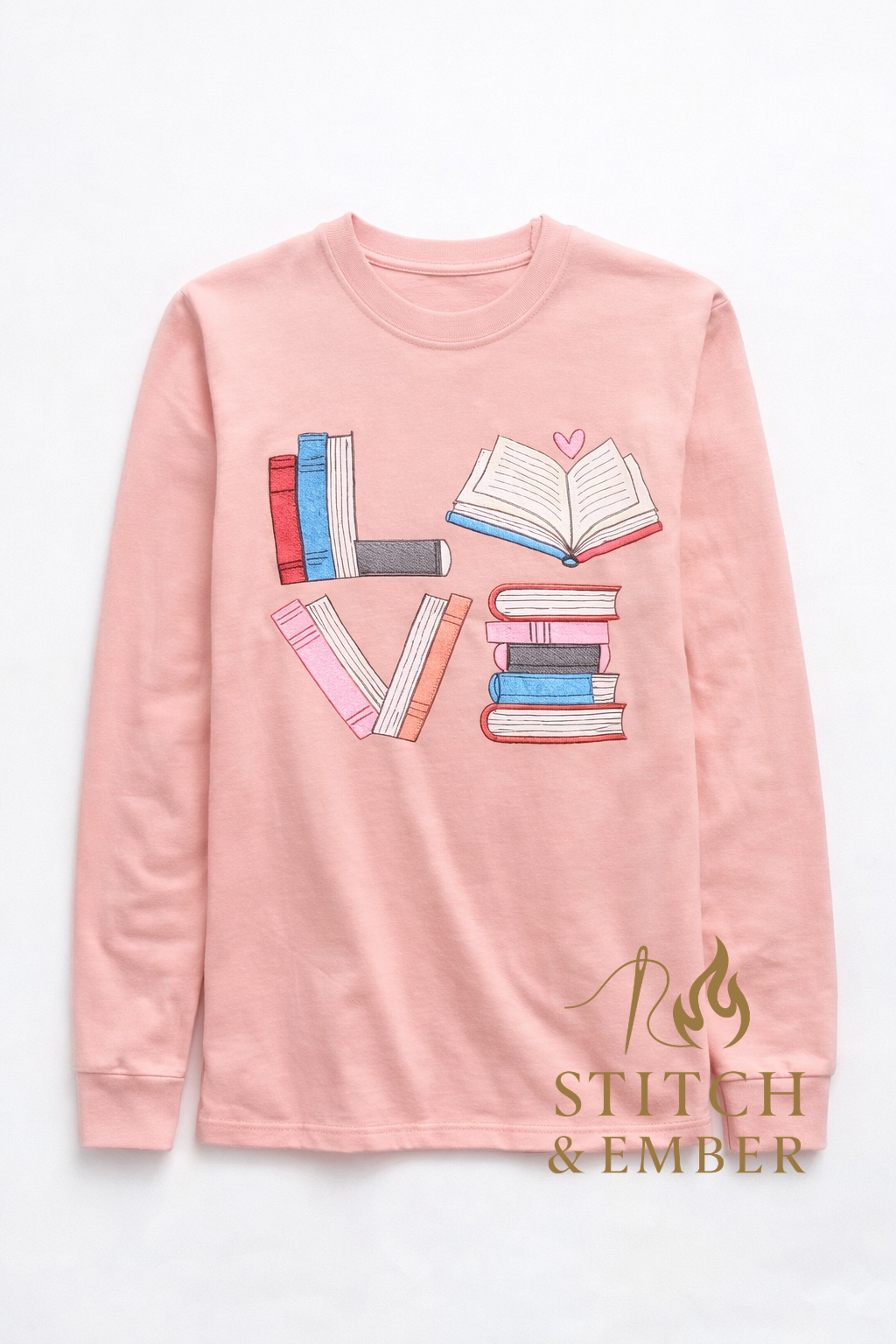 Pink long sleeve t-shirt with book design spelling 'LOVE' on a white background